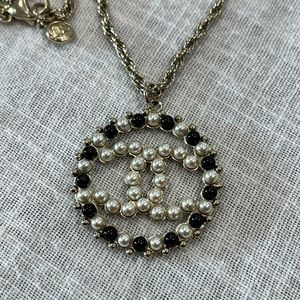 Authentic Chanel gold pearl CC pendant necklace.  Used new condition. No flaws.